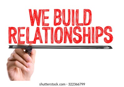 Hand With Marker Writing: We Build Relationships