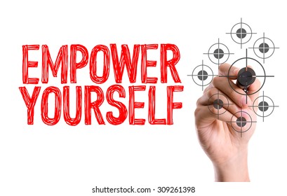 Hand with marker writing the word Empower Yourself