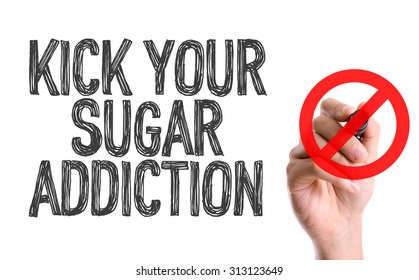 Hand with marker writing the word Kick Your Sugar Addiction