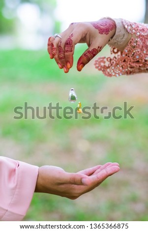 A hand of married couple with wedding ring floating on air. Selective Focus 