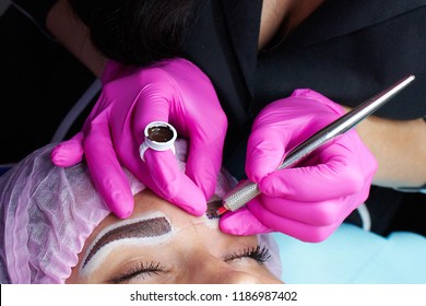 hand master with tool for microblading, training in permanent makeup