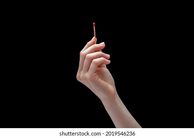 Hand with a match or matchstick off isolated on black background. Concept hands and fire