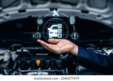 Hand of mechanic holding car service and checking, Customer service guarantee concept - Shutterstock ID 2340377479
