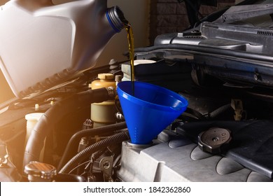 Hand Mechanic In Service To Repair A Car, Pouring Change Lubricant Oil At Maintenance Repair Service Station, Energy Fuel Maintenance Automotive Concept