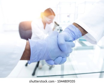 Hand In The Medical Glove (handshake)