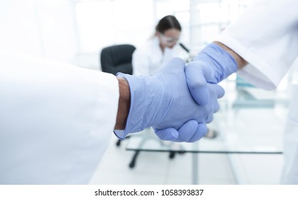 Hand In The Medical Glove (handshake)