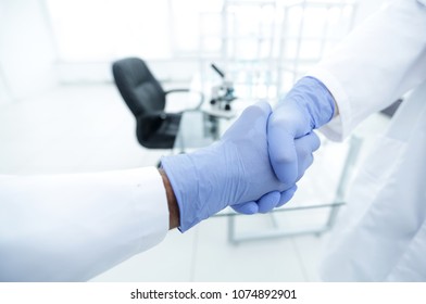 Hand In The Medical Glove (handshake)