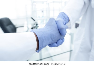 Hand In The Medical Glove (handshake)