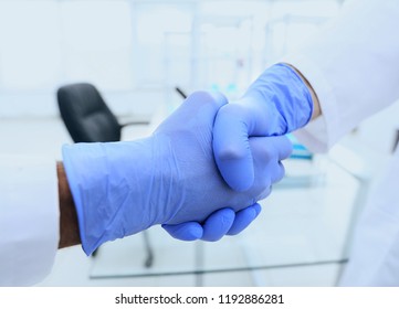 Hand In The Medical Glove (handshake)