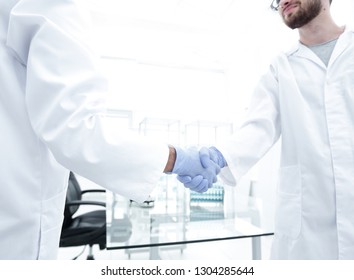 Hand In The Medical Glove (handshake)