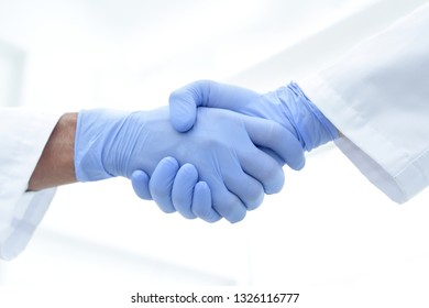 Hand In The Medical Glove (handshake)