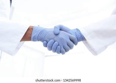 Hand In The Medical Glove (handshake)