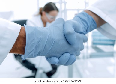 Hand In The Medical Glove (handshake)