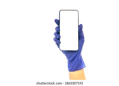 Hand In Medical Glove Holds Phone. Isolated On White.