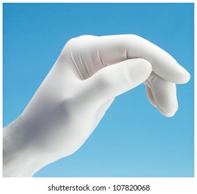 Hand In Medical Glove on Blue Background