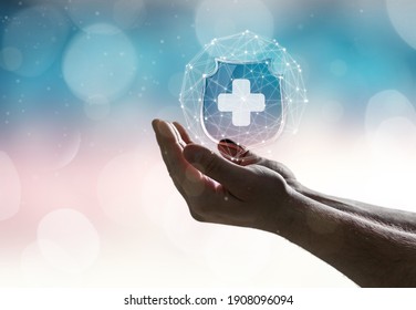 Hand with medical sign on blur background. Medical care insurance - Shutterstock ID 1908096094