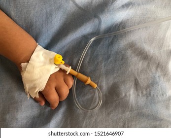 Baby’s Hand With Medicine Dropper. Little Kid On A Drip In The Hospital. Autumn Illness Or Sickness. Healthcare Service And Child Treatment In The Hospital Room