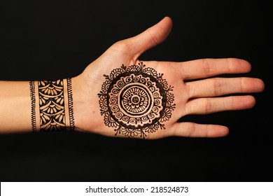 Hand With Mehendi On Black Background