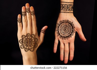 Hand With Mehendi On Black Background