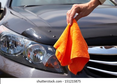 Hand With Microfiber Cloth Cleaning Car.