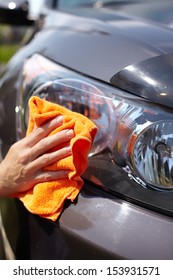 Hand With Microfiber Cloth Cleaning Car.