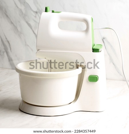 Hand Mixer or Standing  Mixer, Kitchen Device Beaters Batter Maachine. Gear Driven Mechanism to Rotate Beaters in a Bowl Containing Food or Cake Batter 