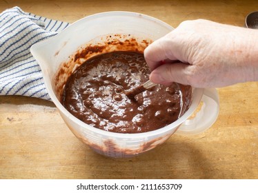 Hand Mixing Chocolate Muffins On Butcher Block Counter With Blue And White Dish Rag Real Kitchens