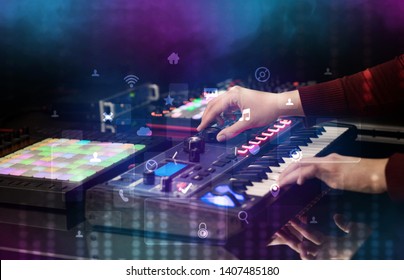 Hand mixing music on dj controller with social media concept icons - Shutterstock ID 1407485180