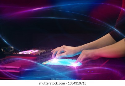 Hand mixing music on midi controller with wave vibe concept - Shutterstock ID 1334310713