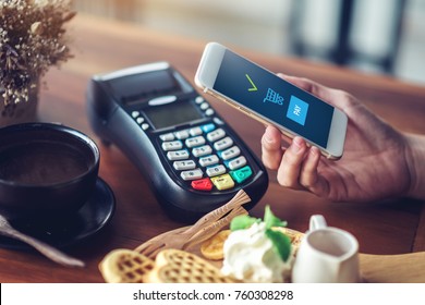 Hand And Mobile Payment In Coffee Shop ,mobile Payment Concept