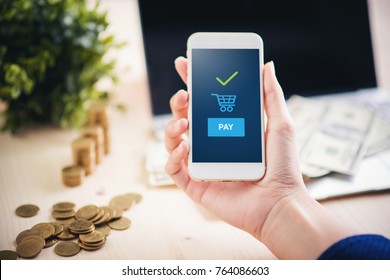 Hand and mobile payment on the table of mobey ,mobile payment concept