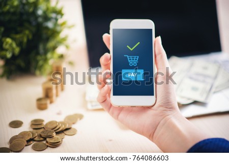 Hand and mobile payment on the table of mobey ,mobile payment concept