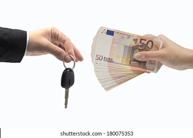 Hand With Money And Car Keys On A White Background