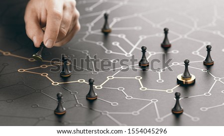 Hand moving pawn on a conceptual maze. Shortcut to success or career guidance concept. Composite image between a hand photography and a 3D background.