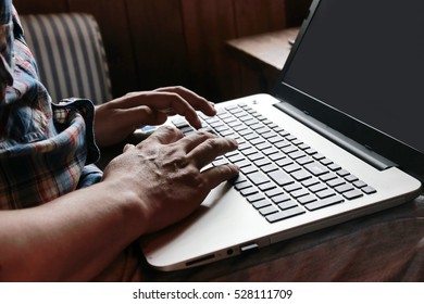 Hand multitasking man working on laptop and phone connecting wifi internet.