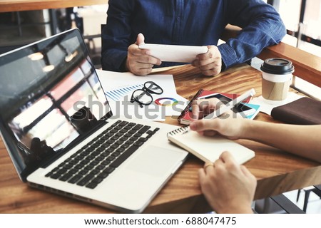 Hand multitasking man working on laptop and phone connecting wifi internet. Business People Meeting Conference Discussion Corporate Concept. Trading Online Public Relations Director Analyze Reports