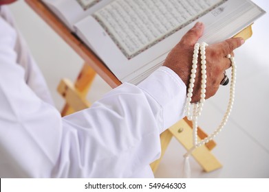 Hand Of Muslim People Recite Holy Quran