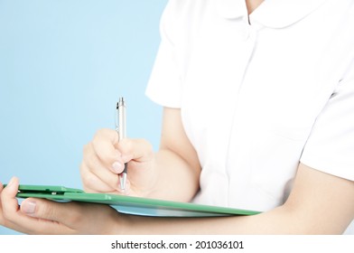 Hand Of A Nurse Taking Notes