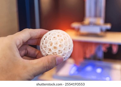 hand with Object printed on 3d printer close-up