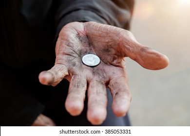 hand old man begging for money because of the hunger in morning light