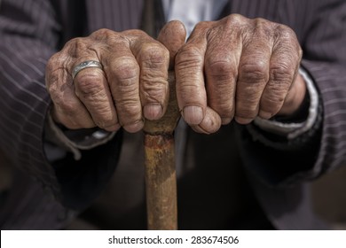 Hand Of A Old Man Holding A Cane