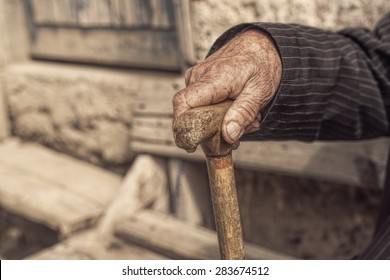 Hand Of A Old Man Holding A Cane