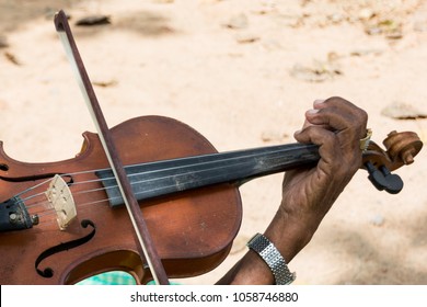 The Hand Of An Old Man Playing A Violin