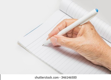 Hand Of An Old Woman Hold Ballpoint Pen Are Writing The Diary