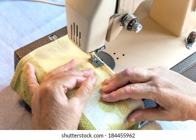 Hand Of The Old Woman At The Sewing Machine