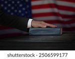 Hand on the Bible in court or the oath on the Constitution of the United States Books of American Wisdom during the inauguration in parliament. Oath of Office