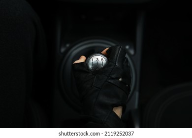 Hand On Car Gear Knob. The Driver Switches The Speed In The Car. Hand On Gear Lever.