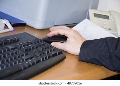 hand on computer mouse