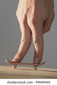 Hand On Finger Skateboard