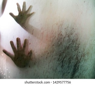 Hand  On Glass Shower Door
Stands Behind Steam Blurred Glass With Water Drops. Rest At Bathroom 